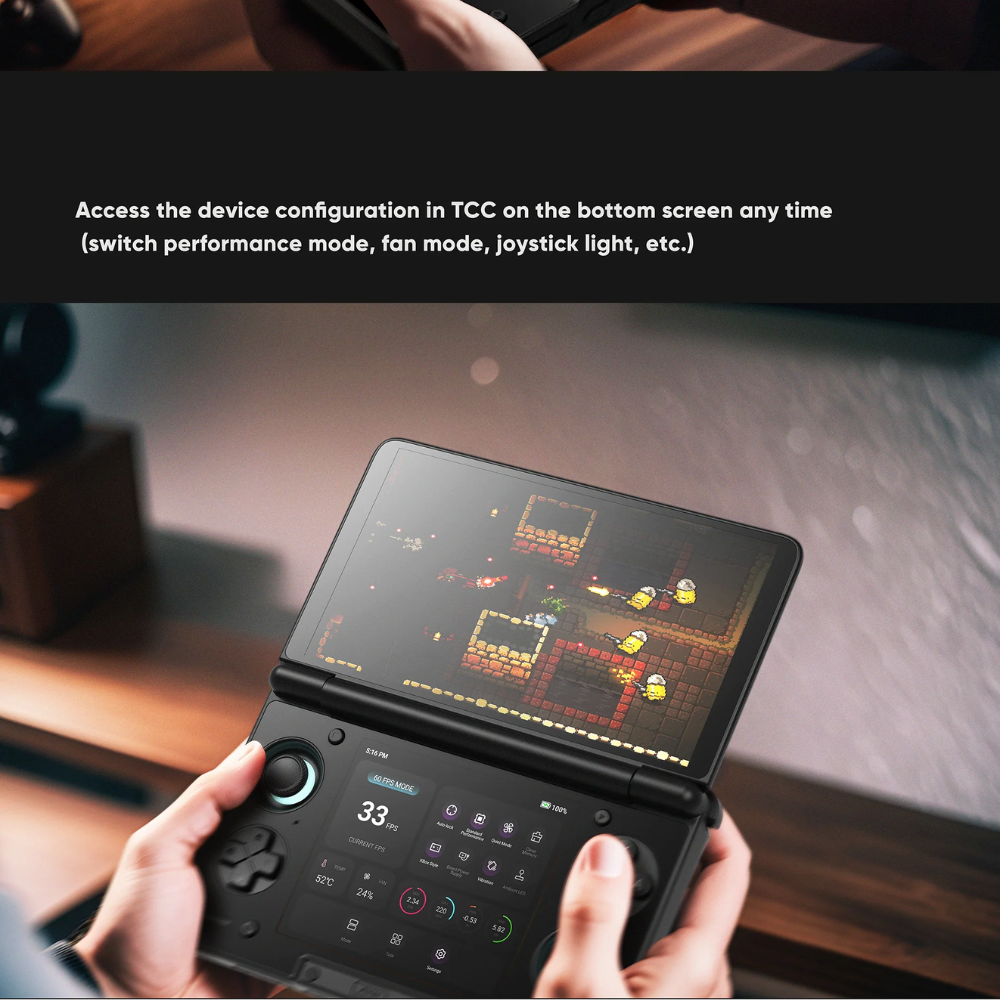 Handheld gaming device with a screen displaying a game, held by a person.