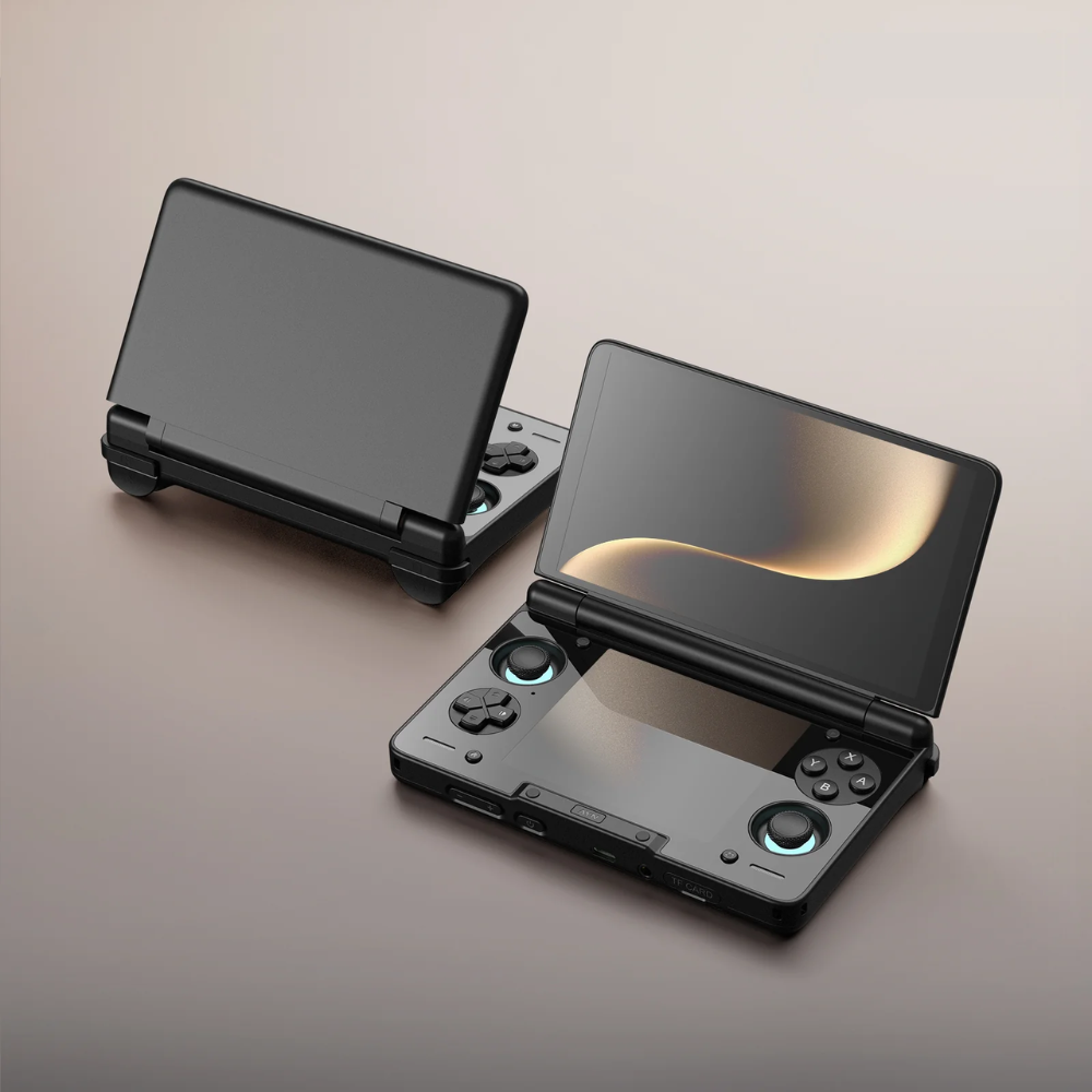 Black handheld gaming console on a gradient background