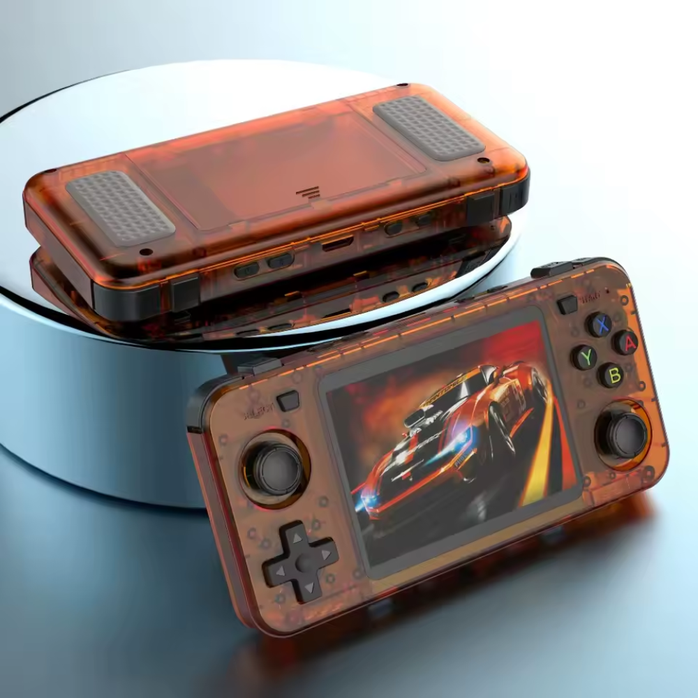 Handheld gaming console with transparent orange casing on a reflective surface