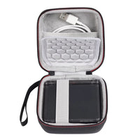 Black carrying case with a honeycomb pattern interior, containing a USB cable and a black device.