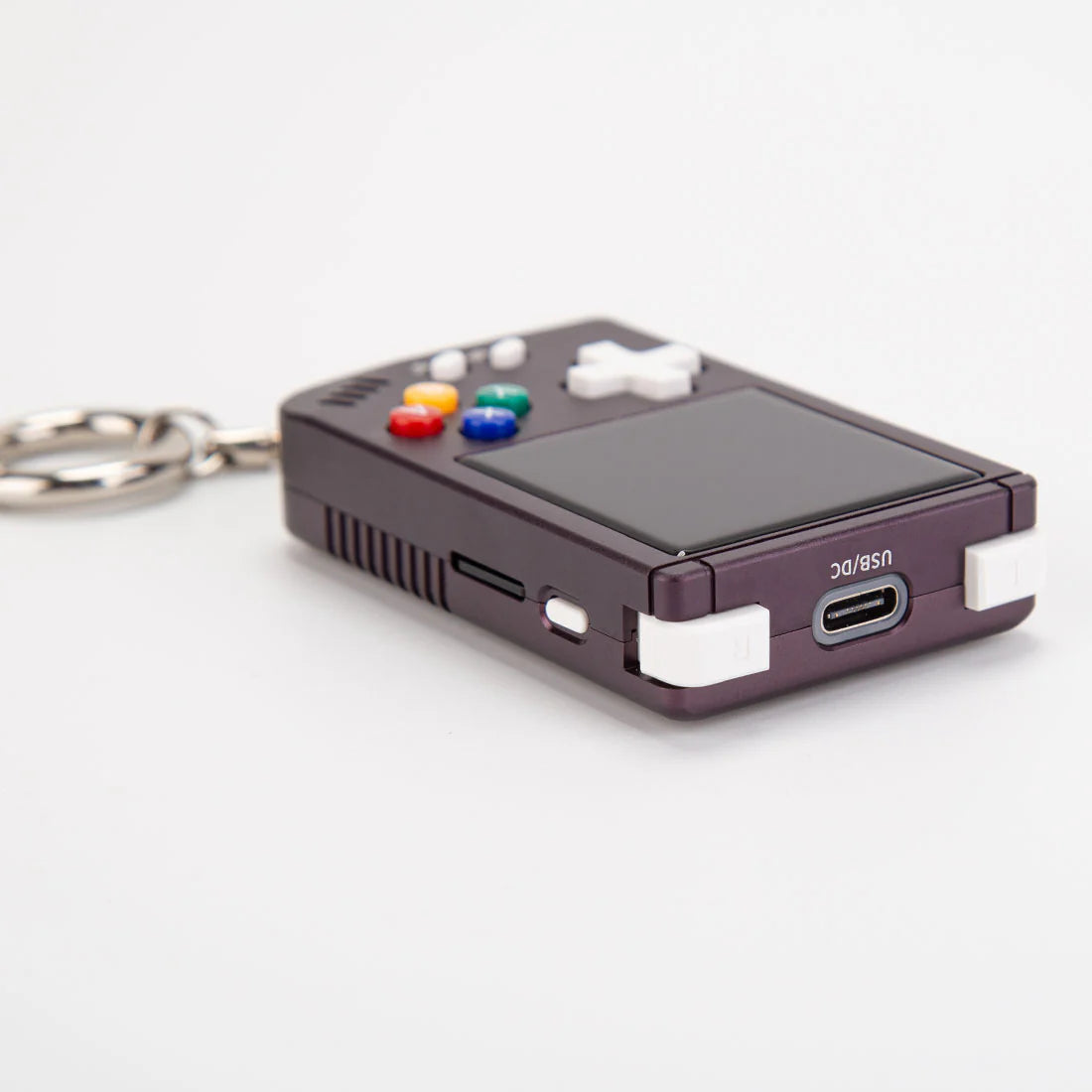 Handheld designed like a classic gaming console controller on a white background