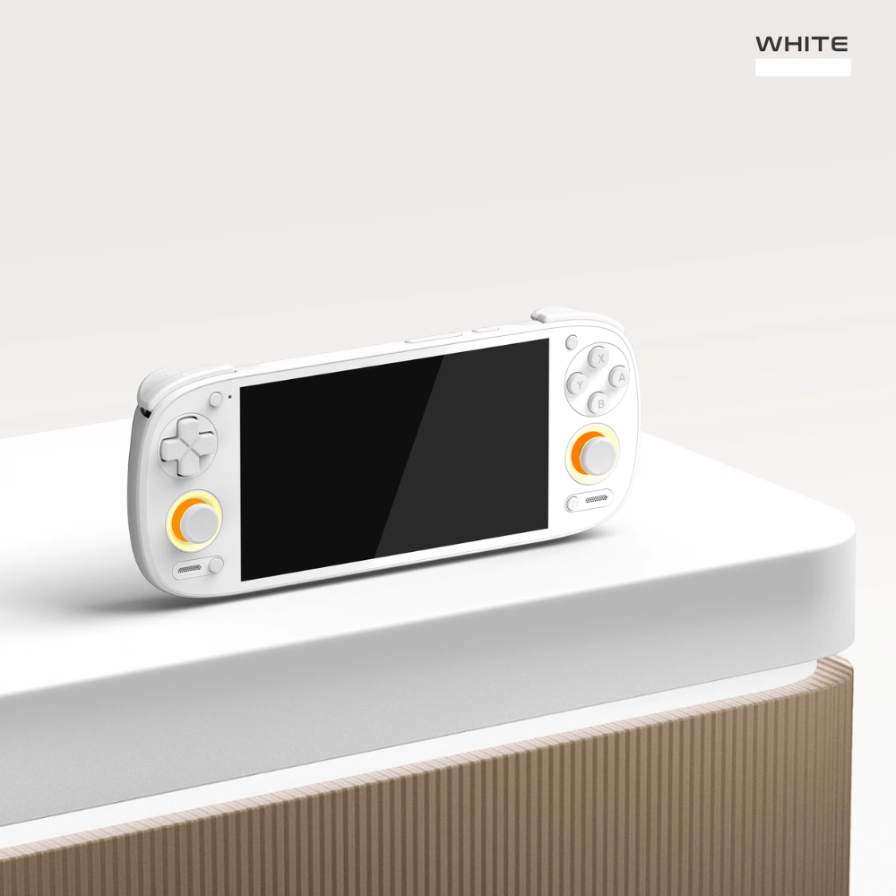 White handheld gaming console on a light gray surface with 'WHITE' text above.