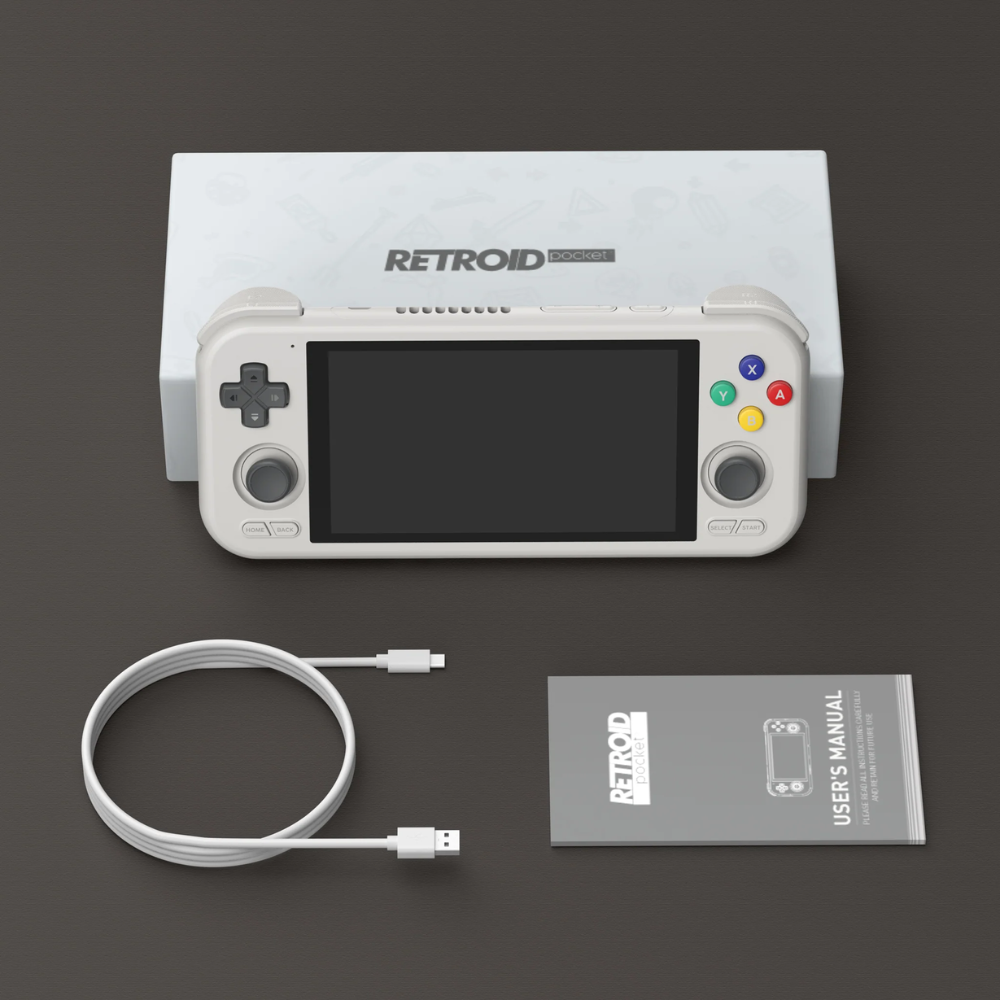 Retroid handheld gaming console with cable and user manual on a dark background