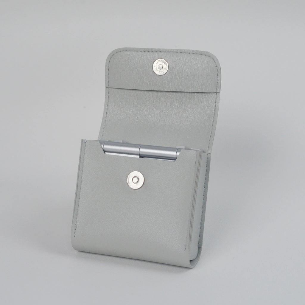 Gray case with metallic accents on a light gray background