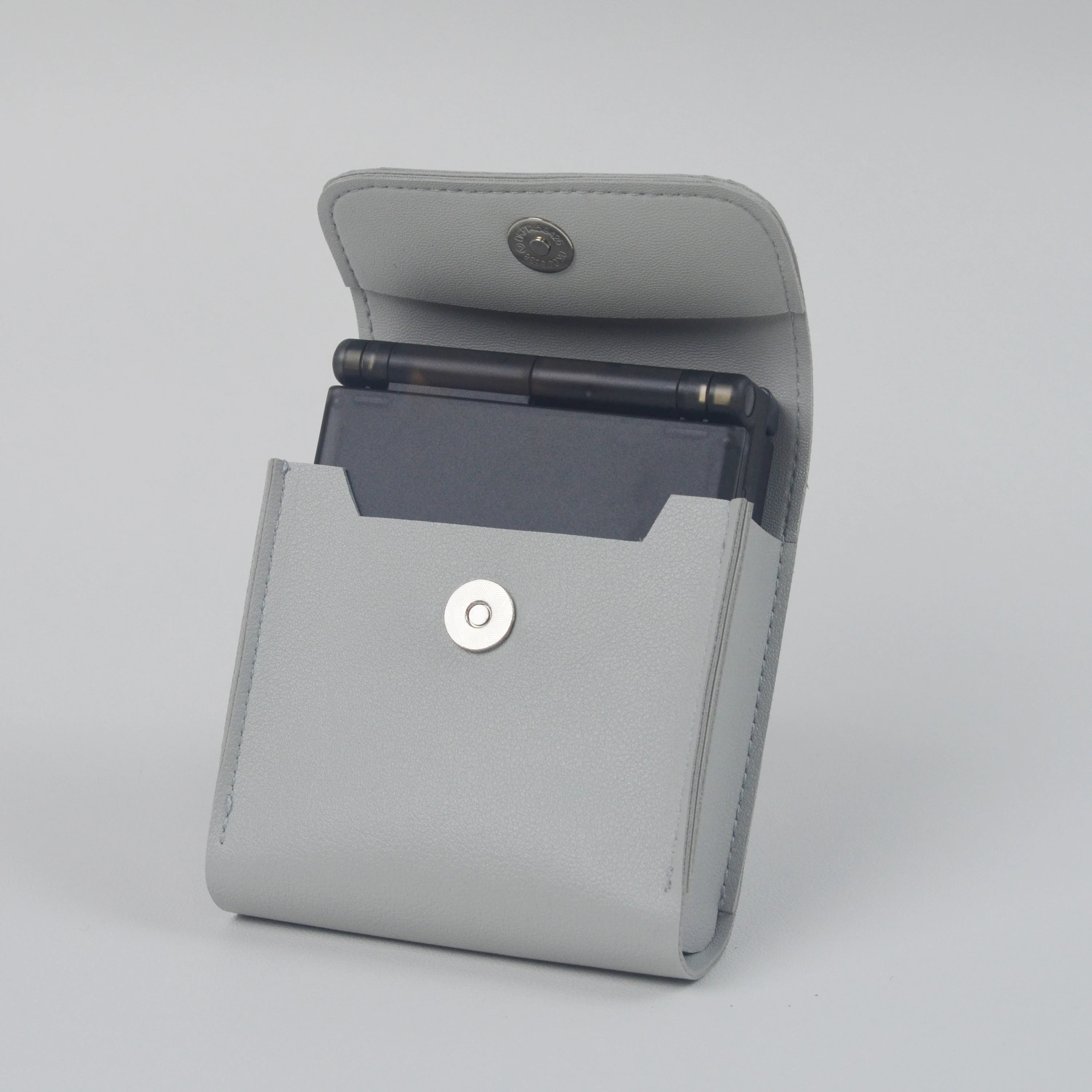 Gray case with a pocket for a smartphone on a light gray background