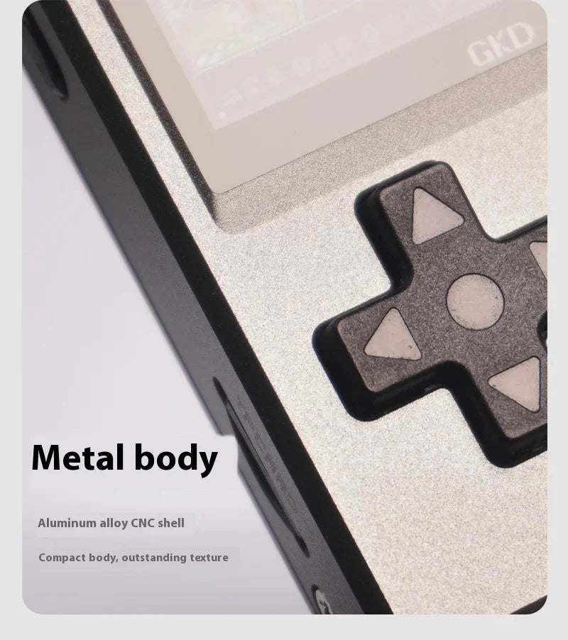 Close-up of a handheld gaming console with metal body and CNC shell, featuring the brand 'GKD'.